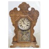 Waterbury carved mantle clock w/ key & pendulum