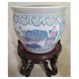 Oriental porcelain planter on wood stand