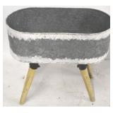 Metal planter on wood legs