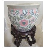 Oriental porcelain planter on wood stand