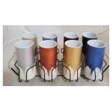 Vintage plastic tumblers in metal rack