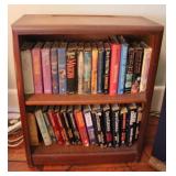 Wood bookcase w/ assorted books