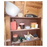 Shelf in shed of assorted garden tools