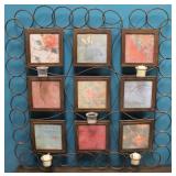 Metal wall frame with candles