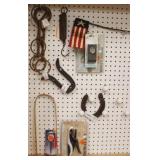 Lot of assorted items on pegboard