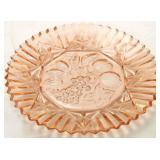 Pink depression glass platter with fruit