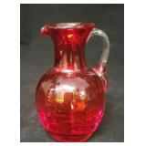 Small blown glass amberina pitcher