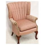 Vintage pink upholstered channel back chair