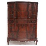 Carved flaming mahogany serpentine front chest