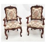 Matching pair heavily carved arm chairs