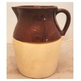 Brown & white stoneware pitcher - 8.5"