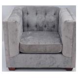 Gray upholstered tufted arm chair