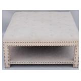 Tufted upholstered ottoman, nail head trim