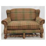 Schnadig wing back loveseat, carved base