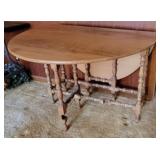 Drop side gate leg table with drawer