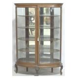 Unusual oval double door china cabinet