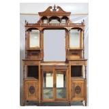 English carved etagere with glass doors