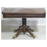 Antique lift top game table, brass toes
