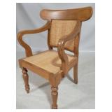 Caned carved wood arm chair