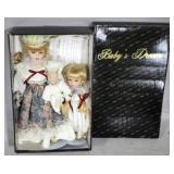 3 Porcelain dolls in box