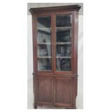 Early English double door corner cabinet