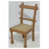 Cane seat carved chair