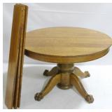Round Oak Pedestal Table w/ 4 Leaves