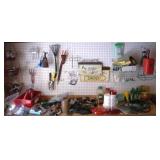 Assorted Items on Peg board and Top of Workbench