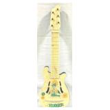 The Hugger Plastic Guitar - 21.5" x 7"