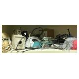 Shelf Lot of Assorted Irons & Vacuums
