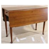 Drop side table with drawers on each side