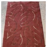 Leaf design area rug