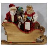 Mr. and Mrs. Claus in sled