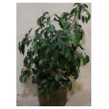 Brass planter with artificial plant