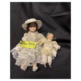 Vintage 8'  full Porcelain Doll, with baby doll No