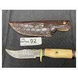 Hunting knife with leather sheath