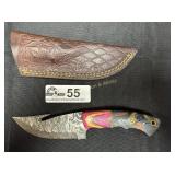 Hunting knife with gut hook and leather sheath