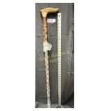 Carved wooden walking cane, approx 1.25' dia.
