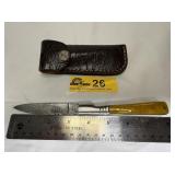 Handcrafted folding pocket knife with leather