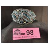 Antique ornate oval-shaped silver-tone hinged brac
