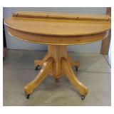 Round Oak Dining Table on Casters w/ 2 Leafs
