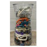 Glass Vase Full of Jewelry