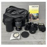 Nikon EM Camera w/ (2) Lenses