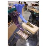 glass vases with brass hands on marble