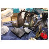 graduated sizes of metal art hands