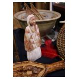 carved stone Native American woman