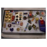 assorted medals and pins