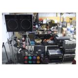 large group of DJ and or Karoake equipment  >>