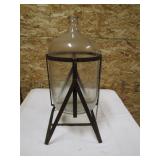 glass water bottle on stand