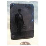 tin type of salesman holding>